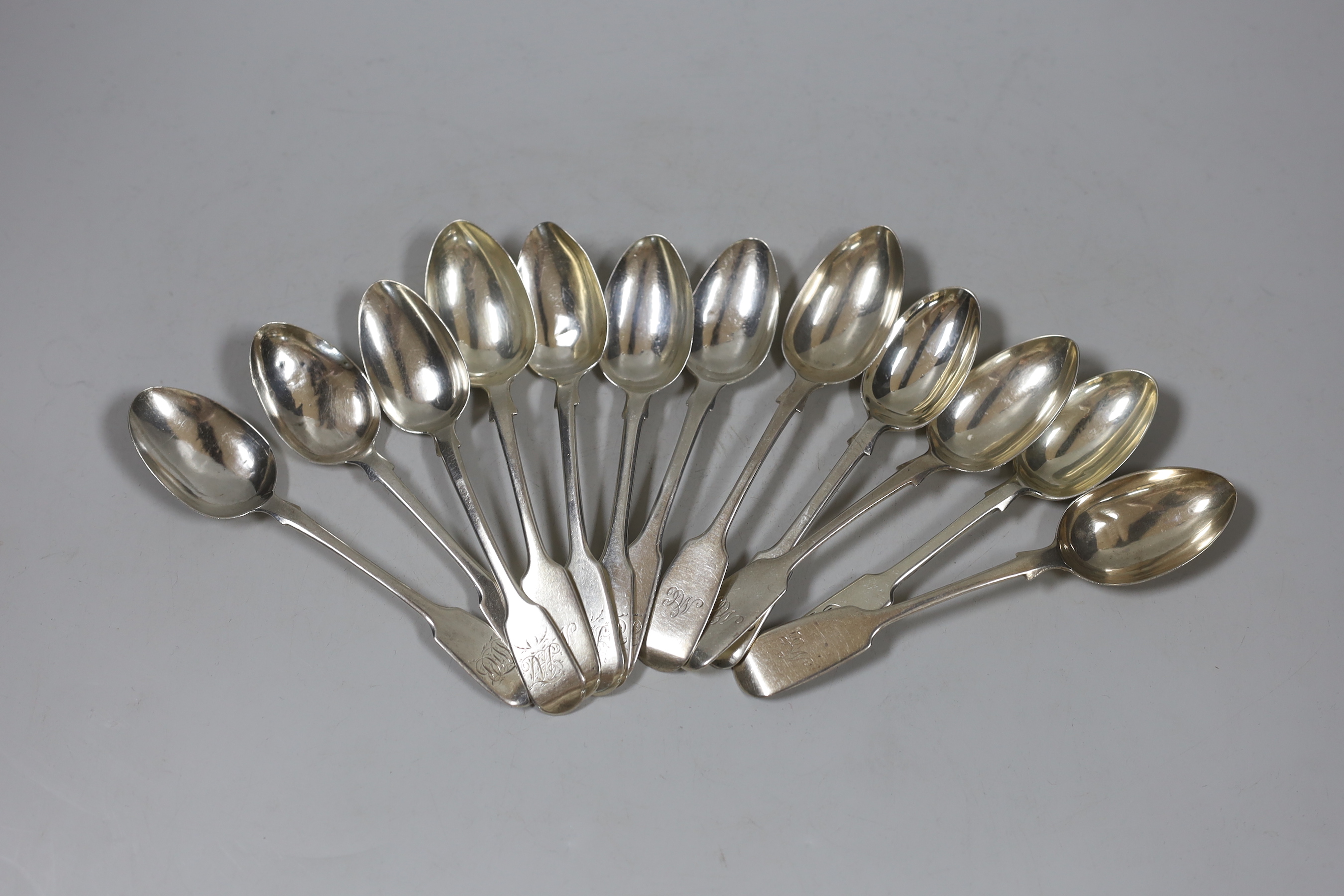 A harlequin set of twelve 19th century silver fiddle pattern teaspoons, various dates and makers, 7.6oz.